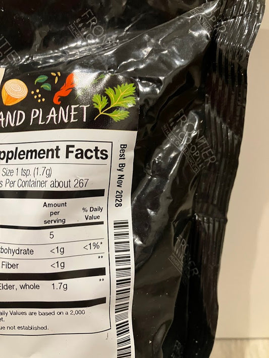 Black package with supplement facts label on a beige background and best buy date of Nov 2028