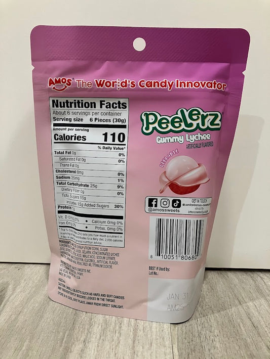 Pink and purple package of PeelGrz Gummy Lychee on a wooden surface