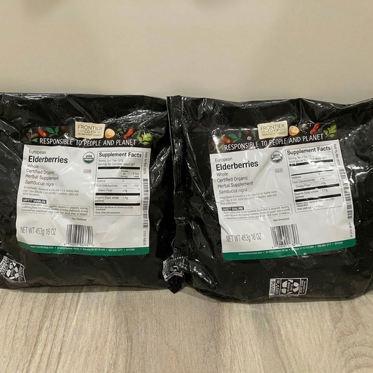 Two packages of Frontier Elderberries on a wooden surface